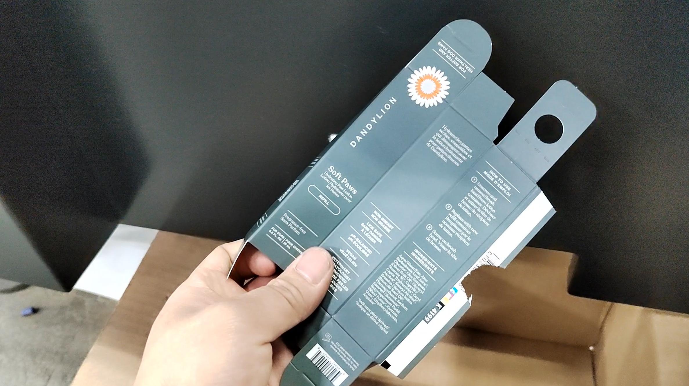 Finished pet care carton inspected after glue wheel and barcode detection