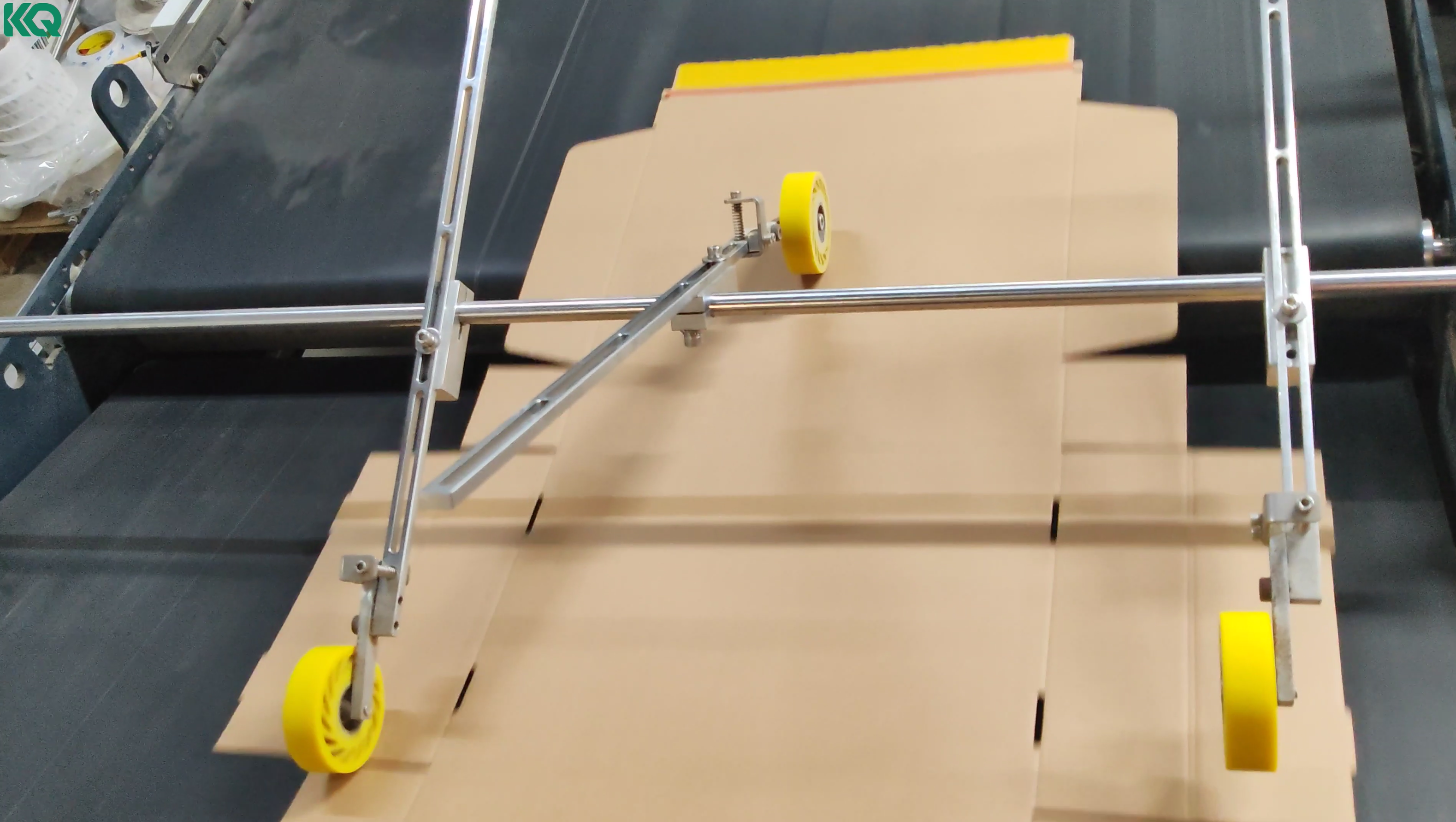 Yellow double-sided tape applied to carton automatically