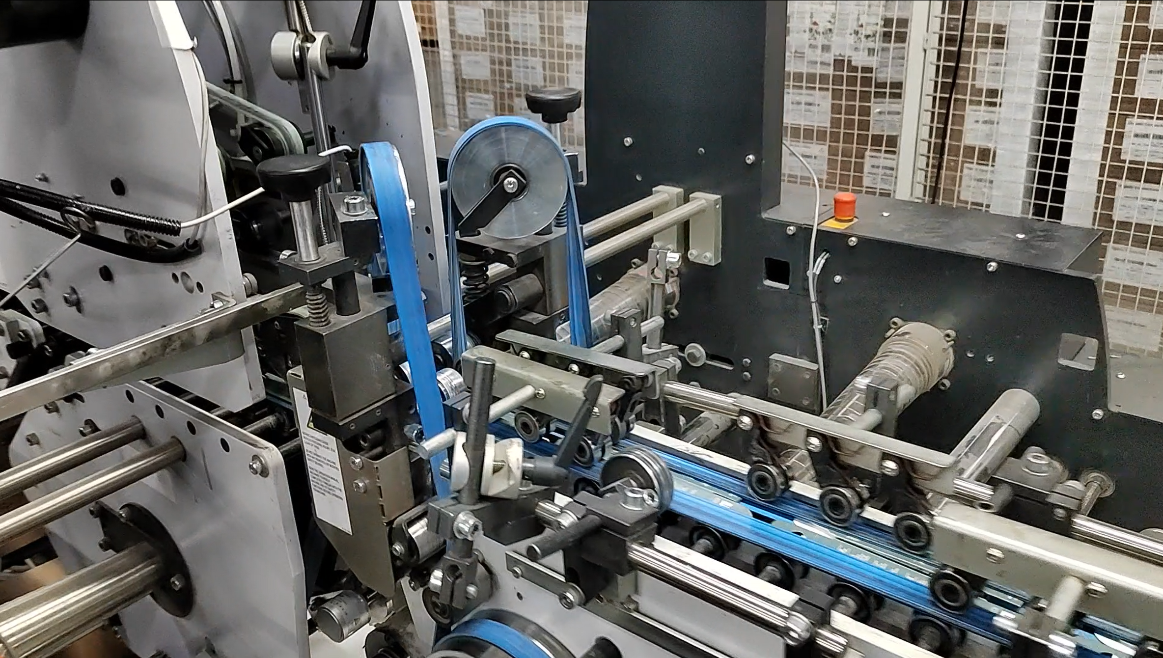 Folding cartons moving through the detection system on the production line