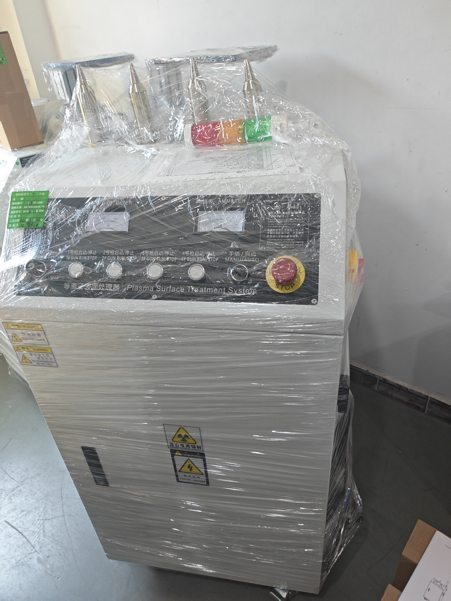 Front view of the industrial plasma surface treatment system with 4 plasma guns and control panel