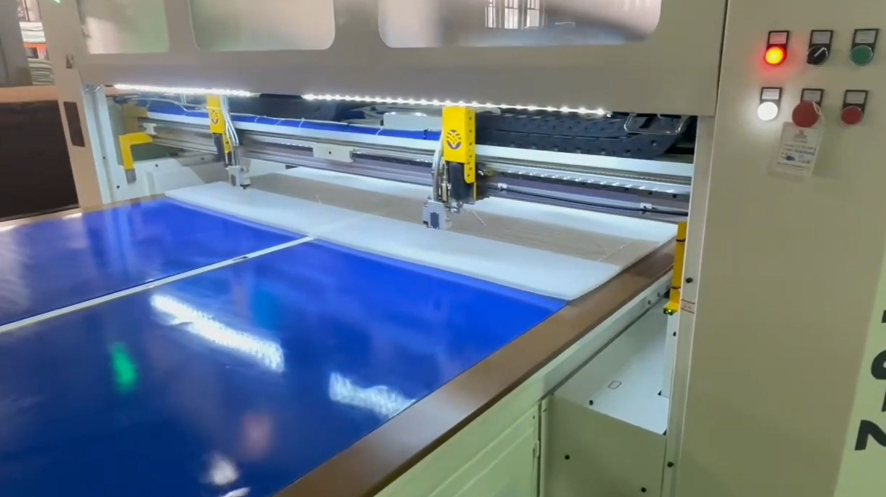 Precision hot melt glue application for mattress bonding