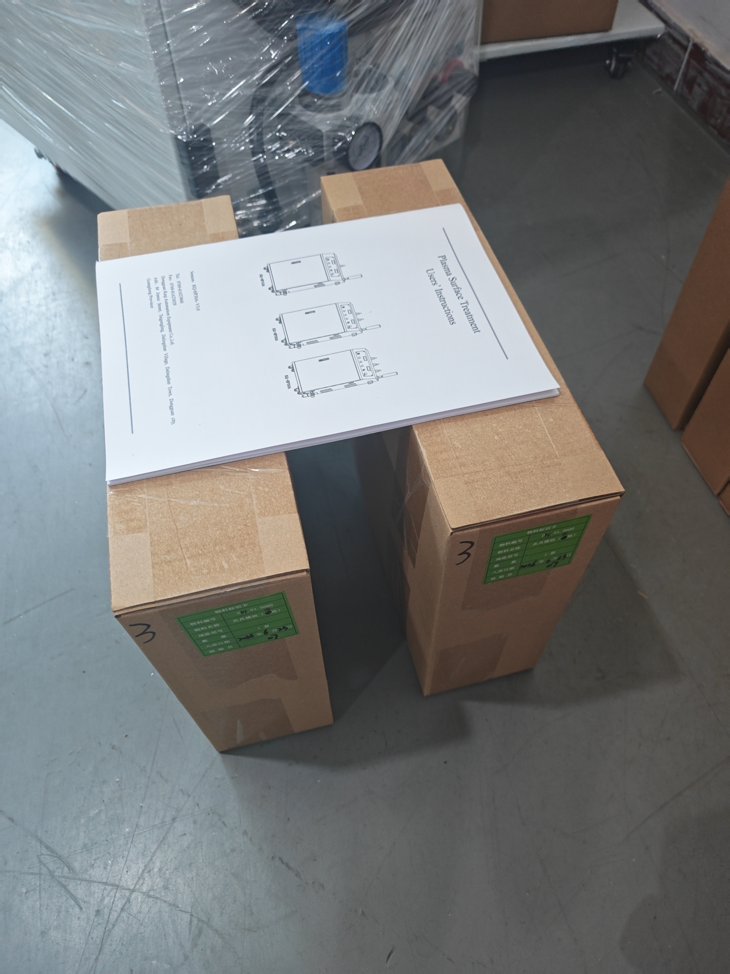 User manual and accessories prepared for the 3-gun plasma surface treatment system before shipment to Spain