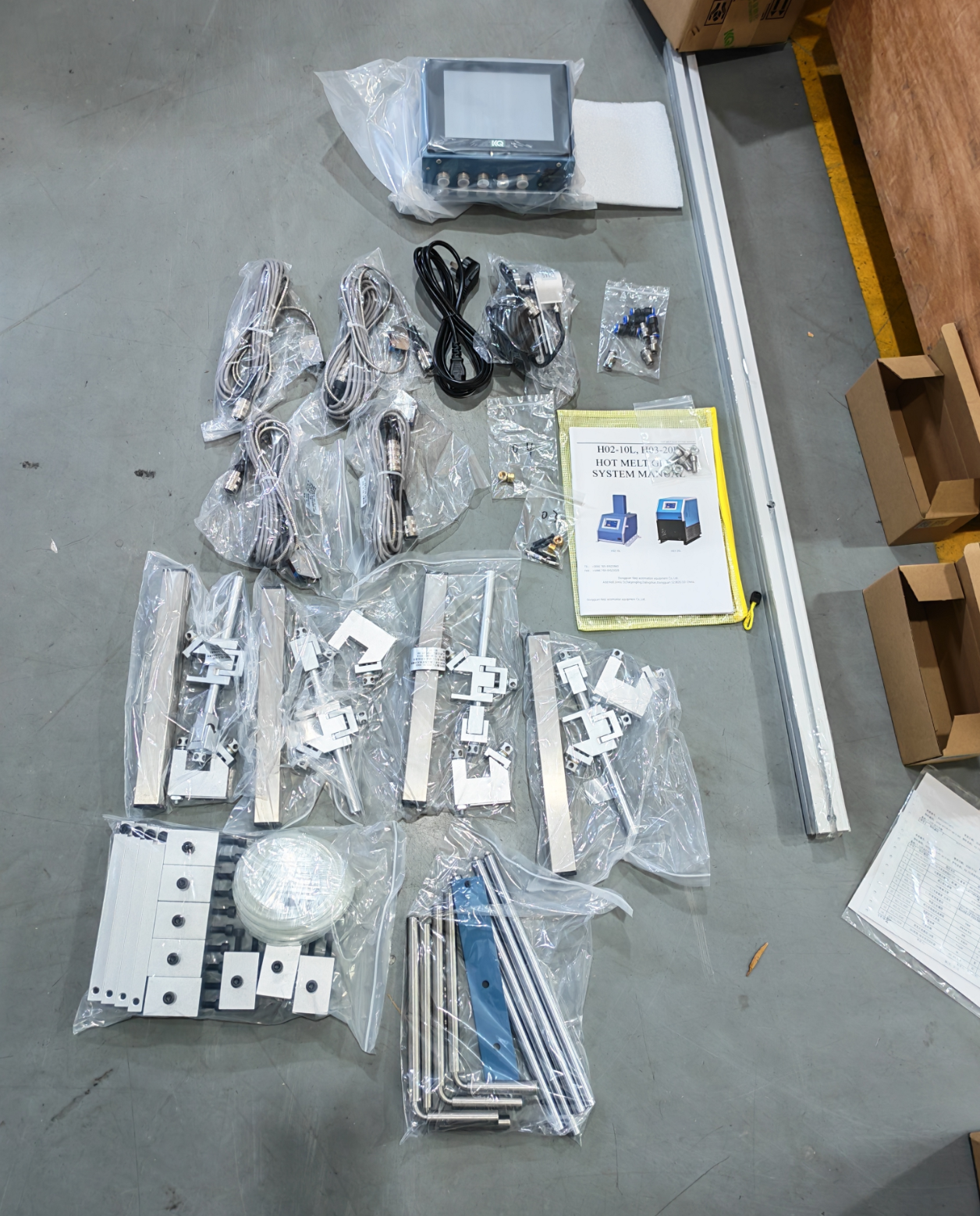 Adhesive controller with hoses, sensors and installation accessories ready for delivery