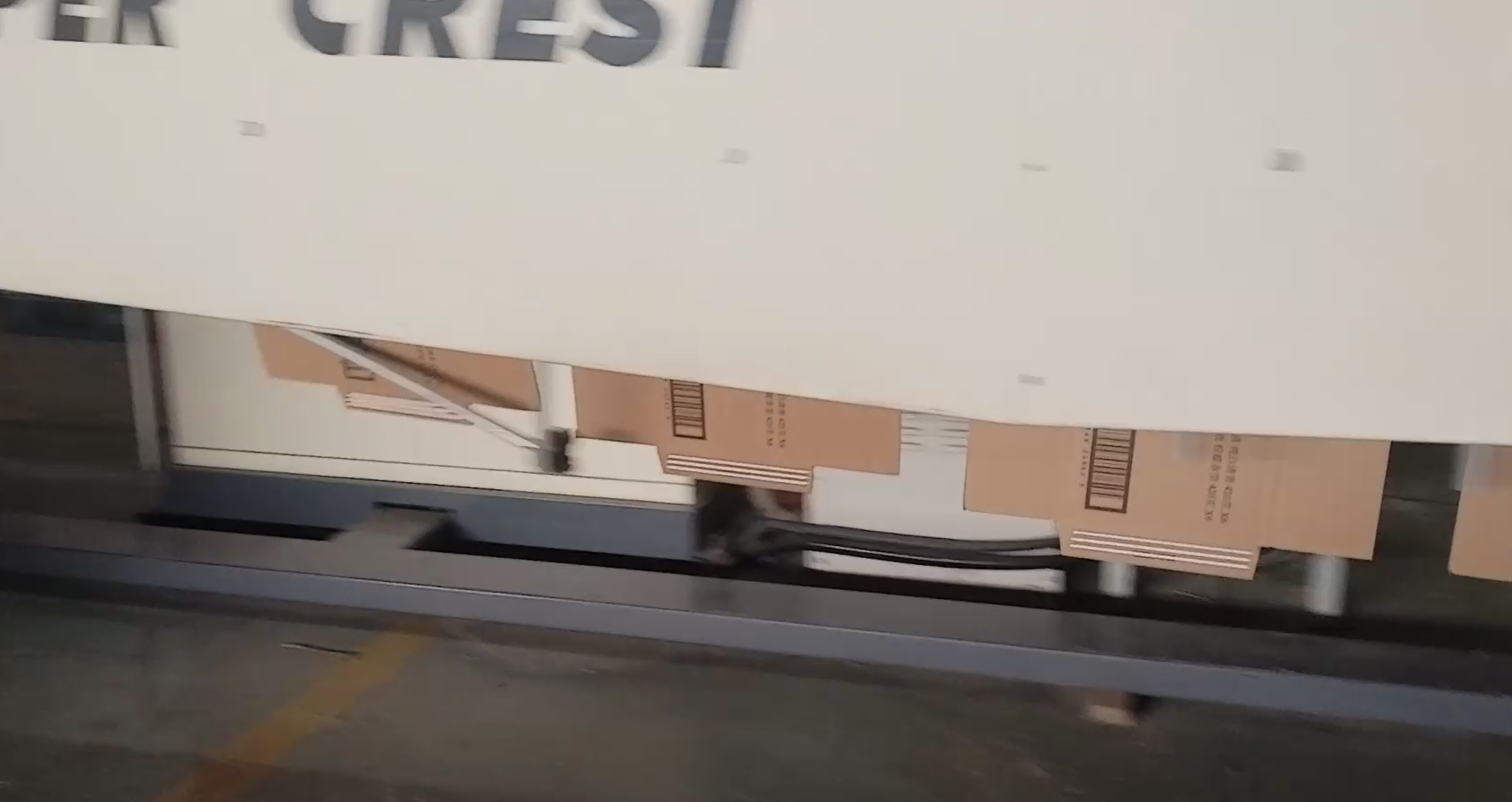 Corrugated carton after cold glue application before folding